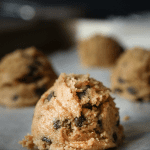 Peanut butter chocolate chip keto fat bombs on a baking sheet.