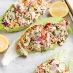 Chicken salad lettuce wraps on parchment paper.