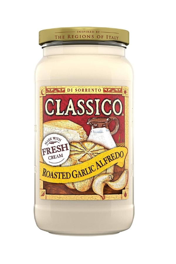 A bottle of classico roasted garlic alfreo suace.