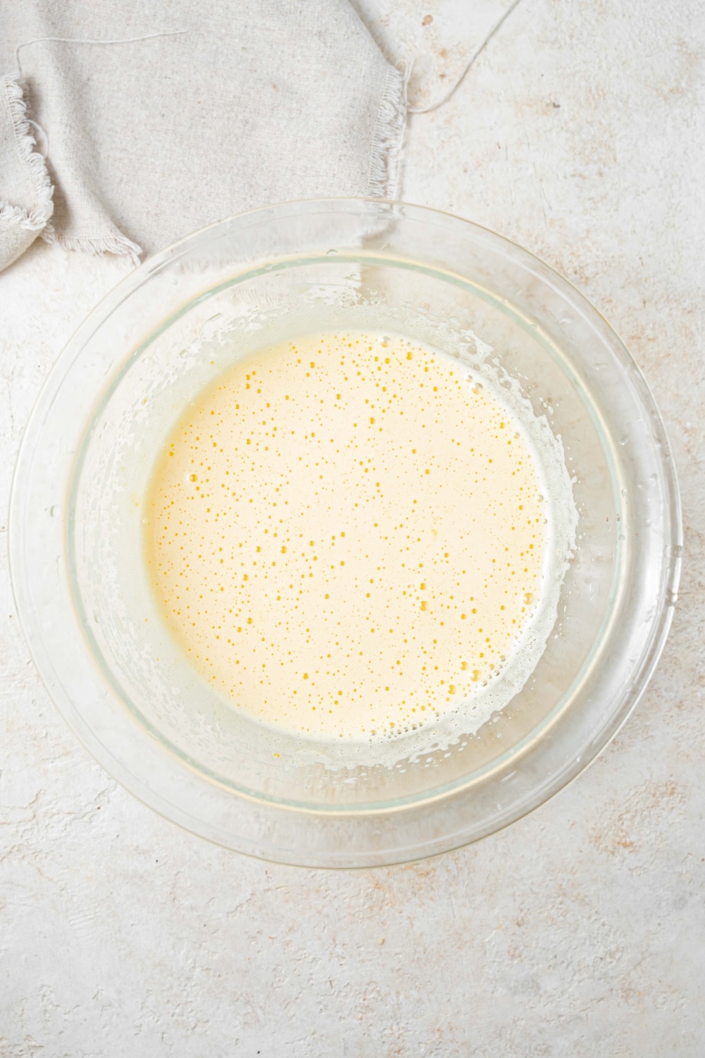 Overhead view of a white creamy mixture.
