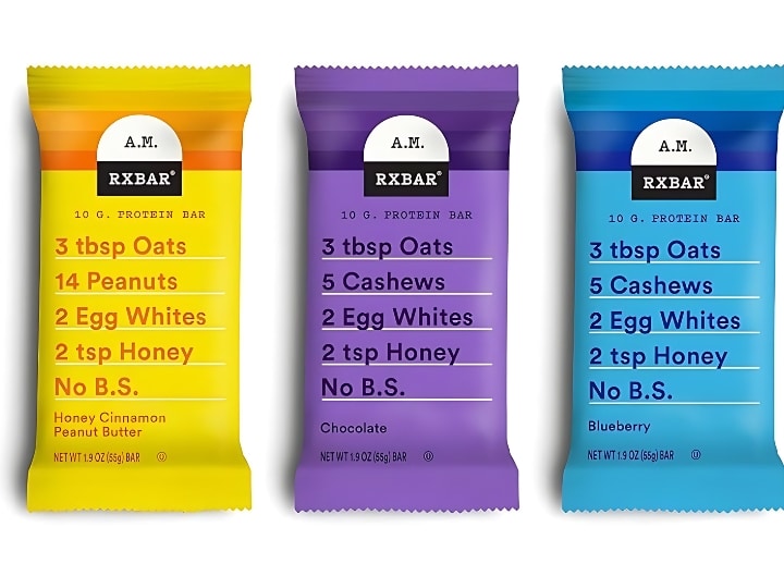 Three wrapped RX AM bars. The flavors are Honey Cinnamon Peanut Butter, Chocolate, and Blueberry all on a white background