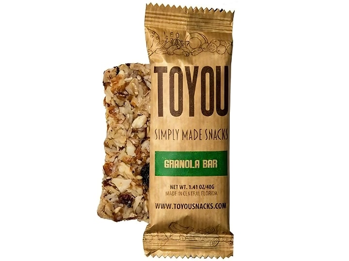 An individual ToYou granola bar in front of an unwrapped bar on a white background.