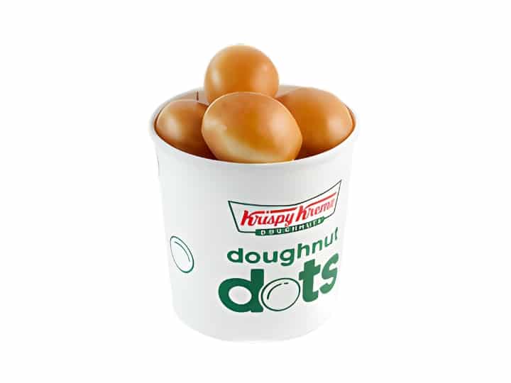 An image of several original glazed doughnut holes from Krispy Kreme in a paper cup on a white background.