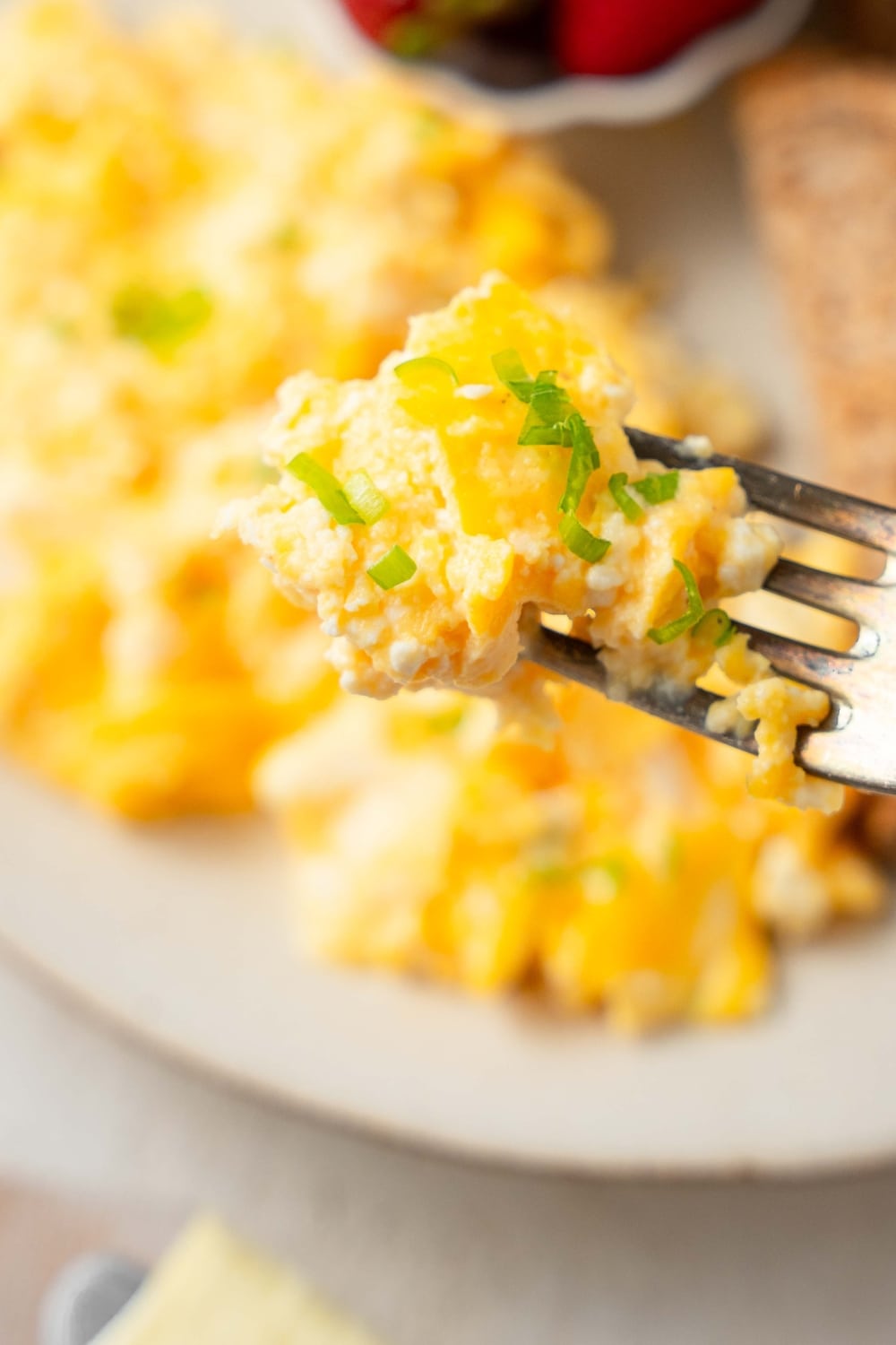 A closer look at cottage cheese omelet on a fork.