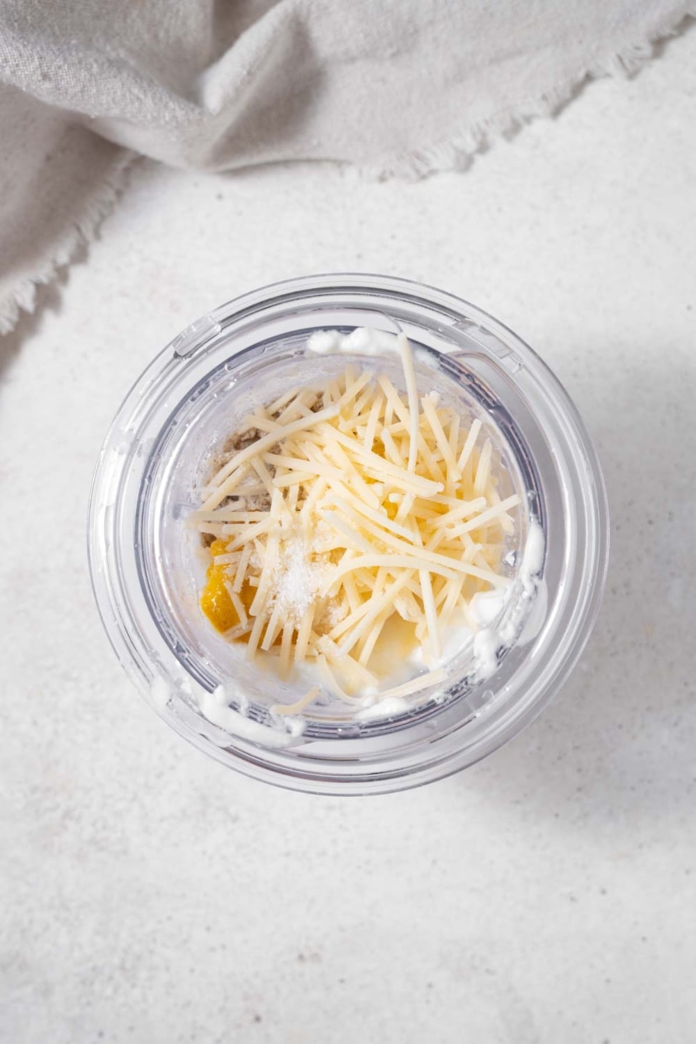Healthy Caesar dressing ingredients in a blender.